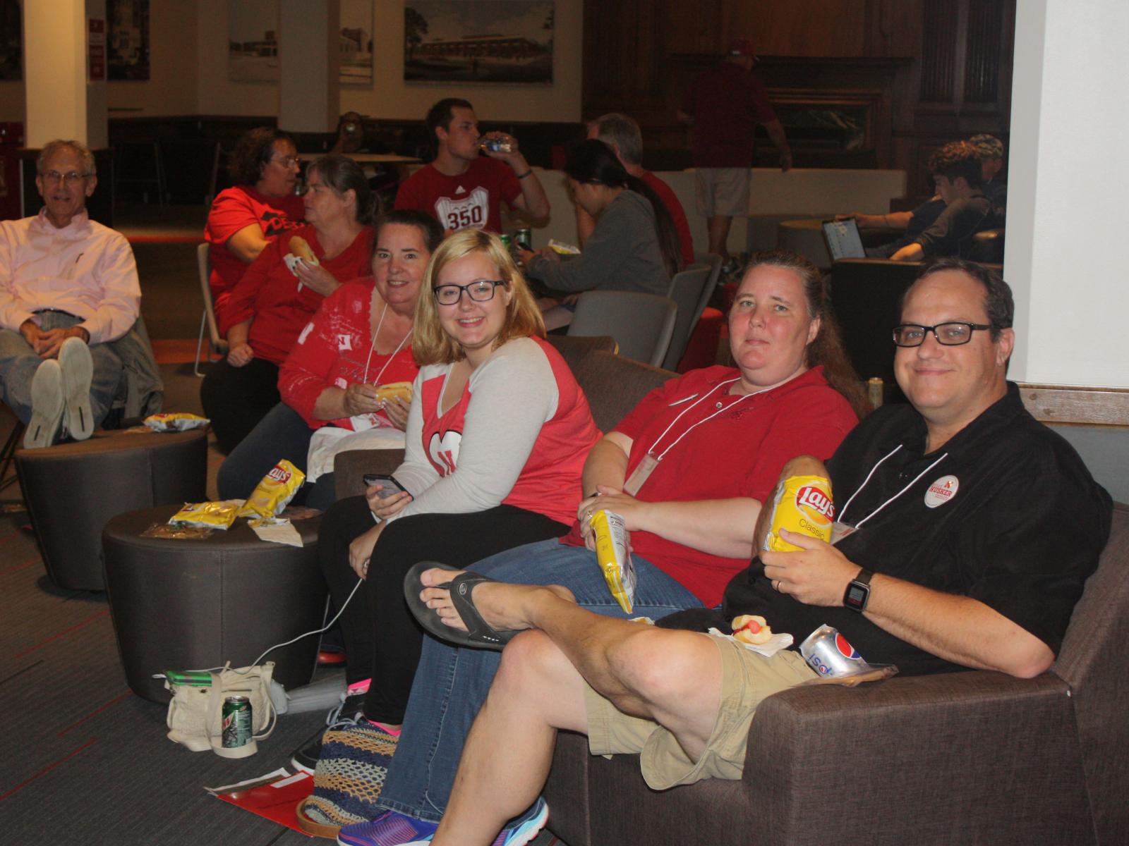 Families watch the Husker football game from the Nebraska Union.