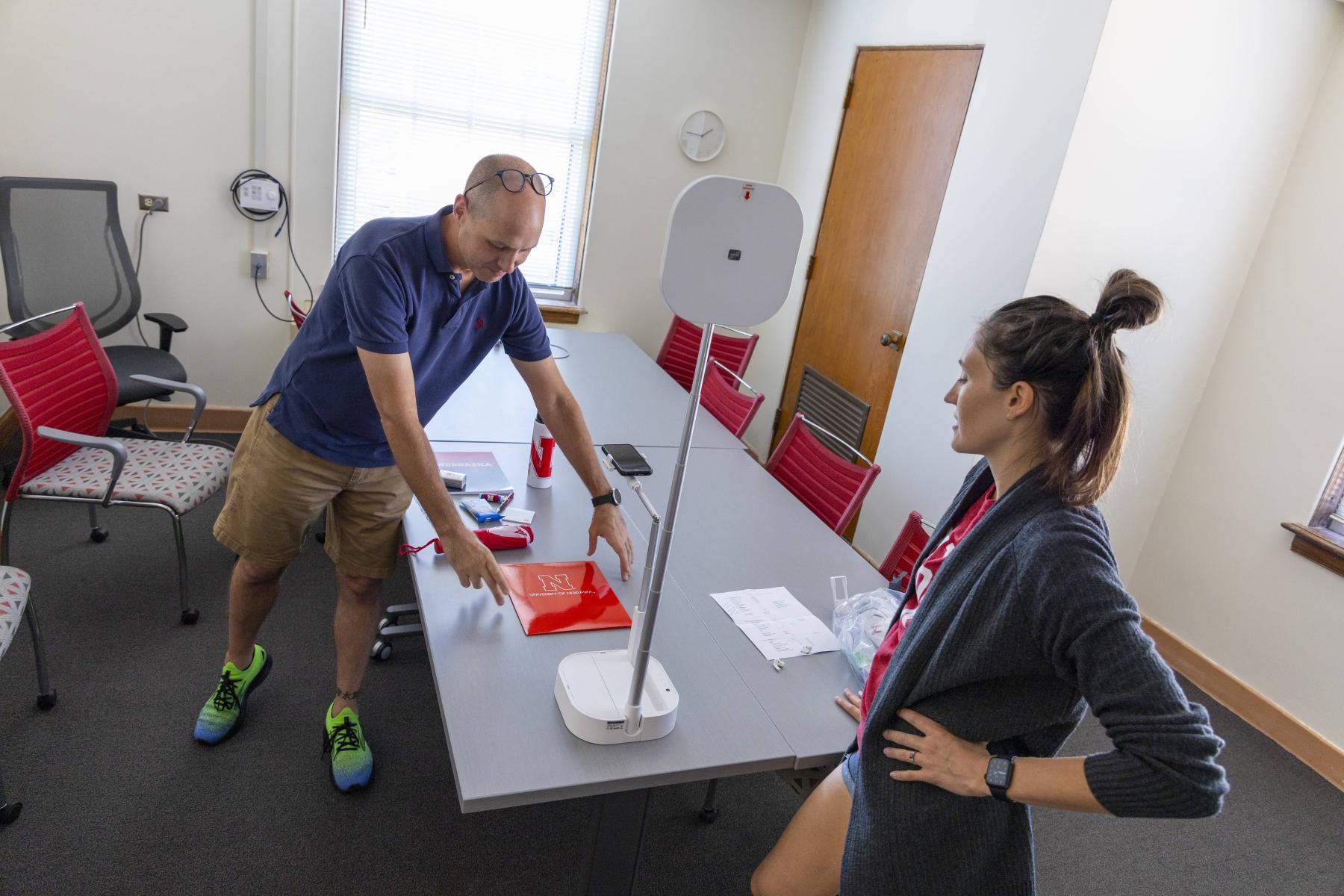 Marketing staff set up items on a table for social media images