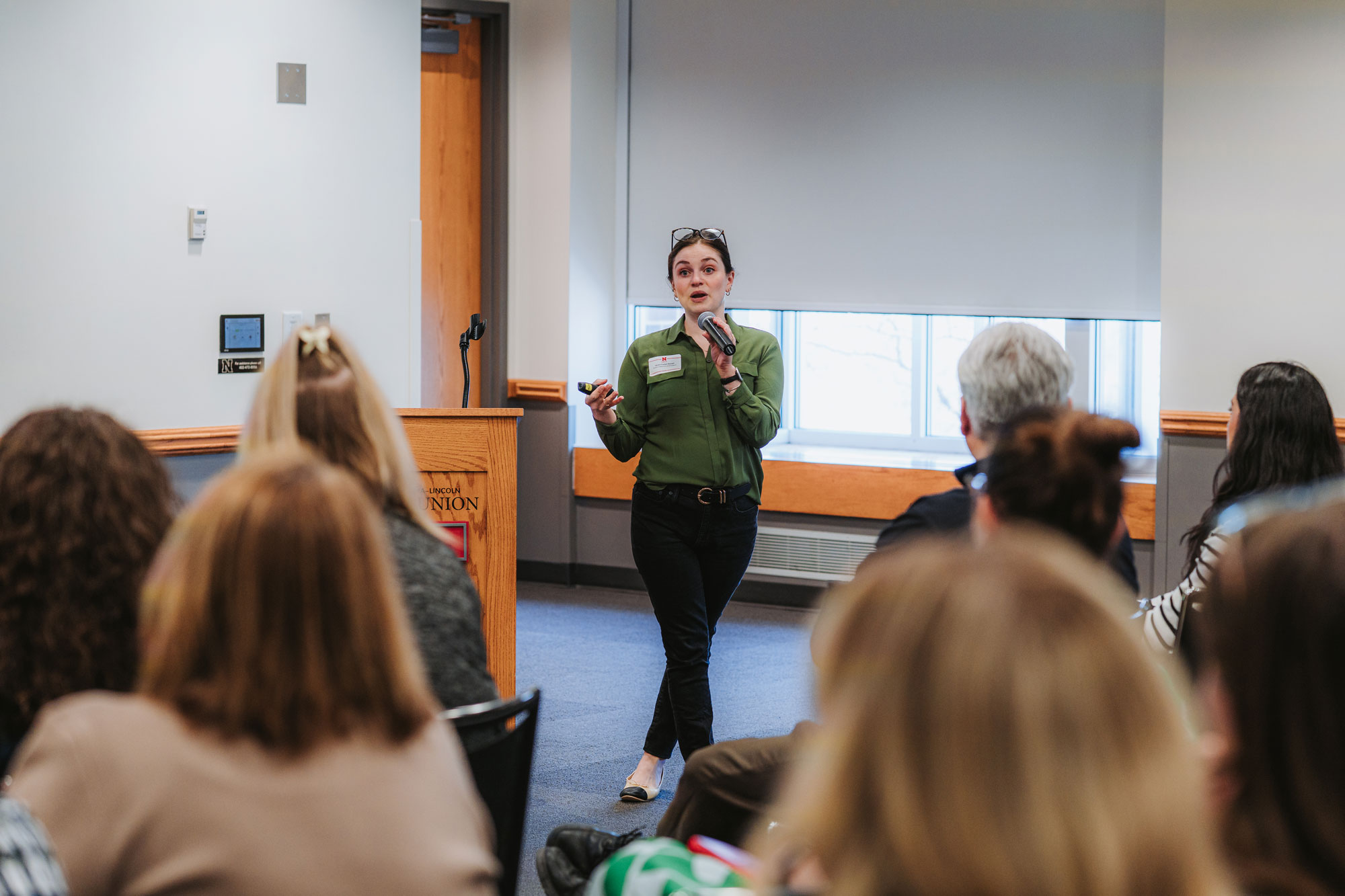 Director of Student Advocacy & Support, Sarah Frankel-Russell presents to a crowd in the Nebraska Union.