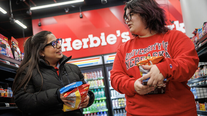 Maha Athar (left) talks with Luna Rivas as they walk down the aisles of the new Herbie’s Market in the Nebraska Union. The market opens Feb. 21 and features Amazon’s Just Walk Out technology, eliminating the need for a traditional checkout counter. [Jordan Opp | University Communication and Marketing]