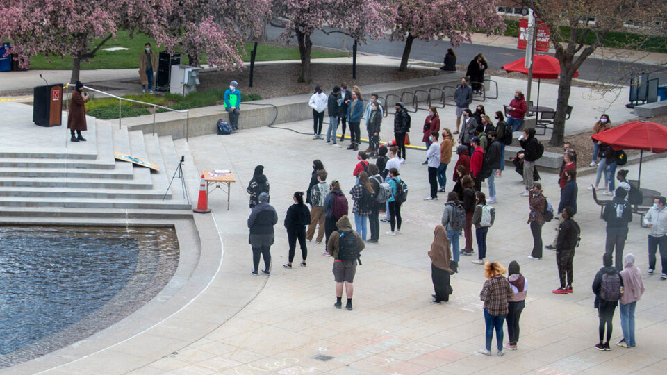 students watch a speaker on the nebraska union plaza
