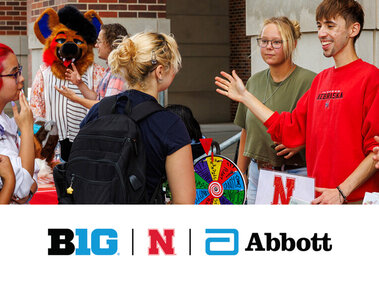 a photo of the 2025 Nvolvement Fair showing an rso at a table talking to other students