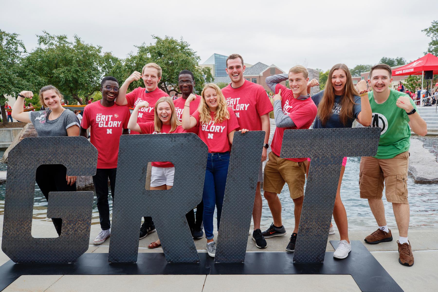 Students with GRIT sign