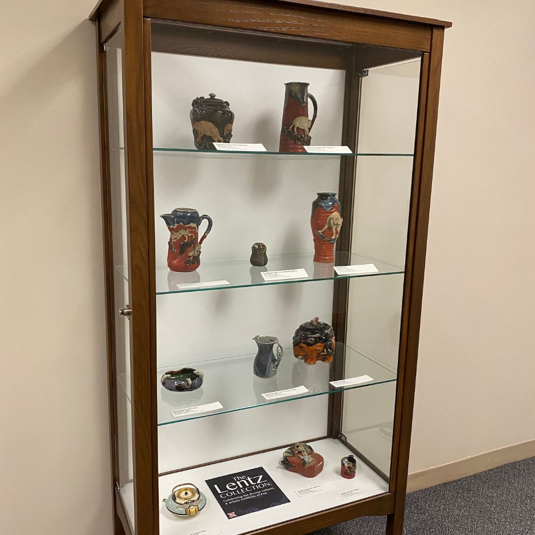 Pottery displayed in a case in Love Library