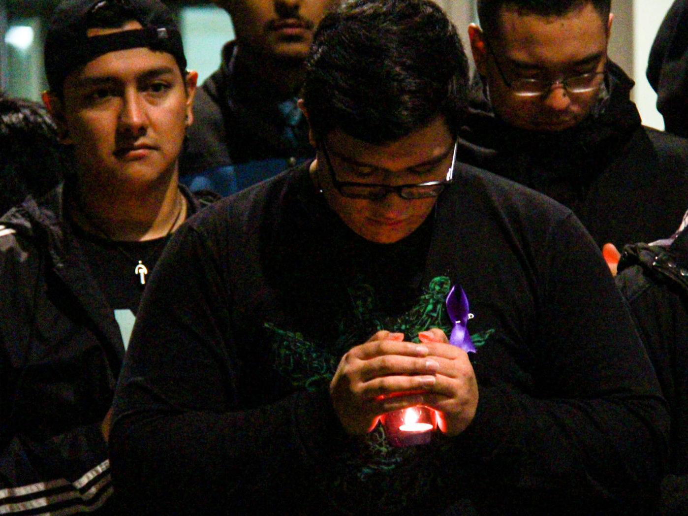A student at the University of Nebraska-Lincoln holds a candle during the Take Back the Night candlelight vigil outside the Nebraska Union on Tuesday, Oct. 9, 2018, in Lincoln, Nebraska. | Daily Nebraskan, Photo by Johnna Sisneros