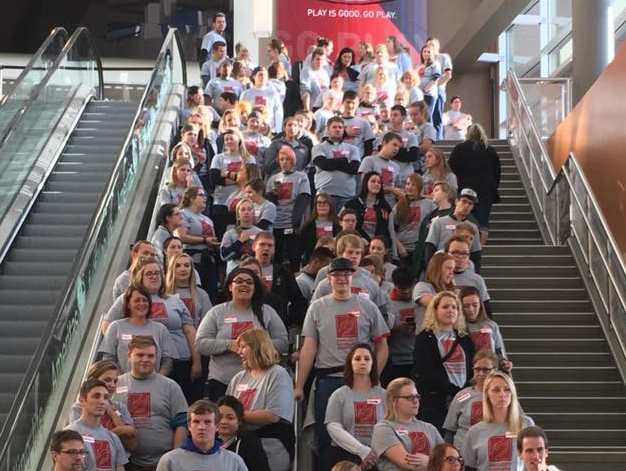 Volunteers gather before the opening of the Project Connect and Standdown inside the Pinnacle Bank Arena in Lincoln, Nebraska. 