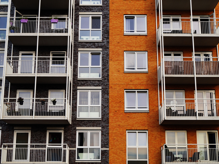 Exterior facade of a multi-story apartment building.