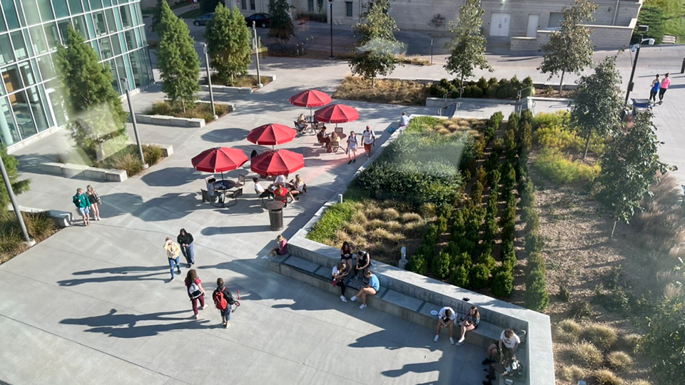 Students walk through the plaza adjacent to the Willa Cather Dining Center. [photo by Student Affairs Marketing and Communication]