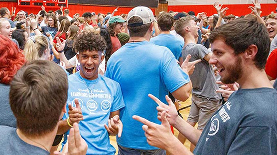 Students participate in an ice breaker activity at the Nebraska Coliseum