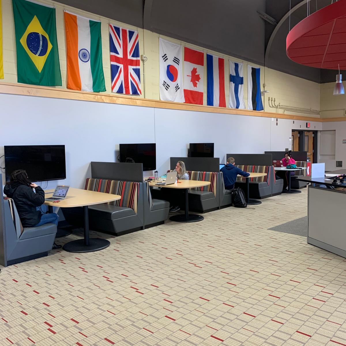 students in study booths inside Henzlik Hall.