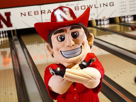 Herbie throws bones in front of the Nebraska bowling alley