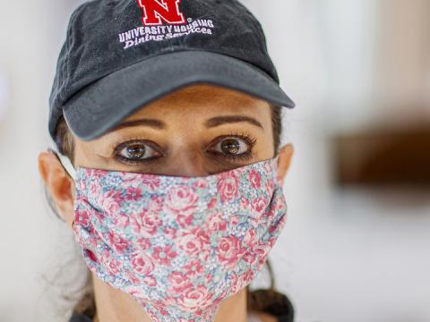 Simone Bilha, a dining service team leader in the Willa Cather Dining Center, wears a homemade cloth mask as she works on April 7. The university is seeking the donation of more than 1,000 homemade masks for essential employees. The masks will help increase safety for workers who continue to serve the campus community.