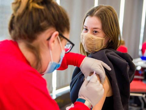 Student receives a vaccination