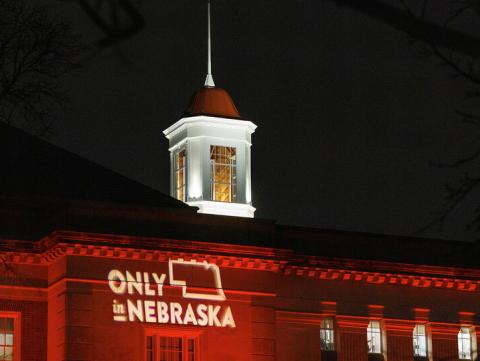 Love Library glows red as part of the university's annual Charter Day celebration. The anniversary observance includes the annual Glow Big Red giving campaign. [Craig Chandler | University Communication]