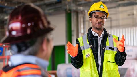 Nebraska's Andre Tharp III gestures as he talks with Dean Lance C. Pérez during a recent tour of Kiewit Hall construction. [Jordan Opp | University Communication and Marketing]