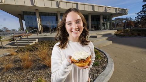 Alexa Carter holds her chili roll creation. [Craig Chandler | University Communication and Marketing]