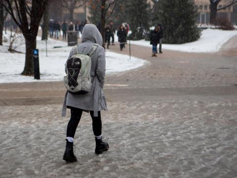 A student walks through the slush outside of the Nebraska Union on Thursday, Jan. 23, 2020, in Lincoln, Nebraska. | Daily Nebraskan