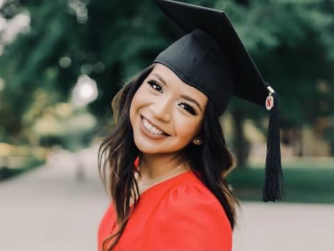 Carolina Saquiche Dominguez portrait with graduation regalia