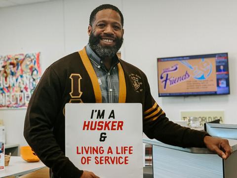 Kenji Madison stands in the Big Red Resilience & Well-Being office.