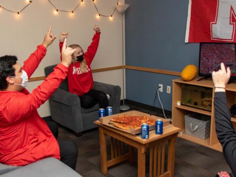 Cheering on Husker football with masks and social distancing