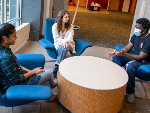 Students meet with a counselor-in-residence at a UNL residence hall.