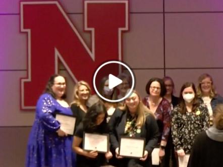 Award recipients pose for a photo at the Women's History Month reception