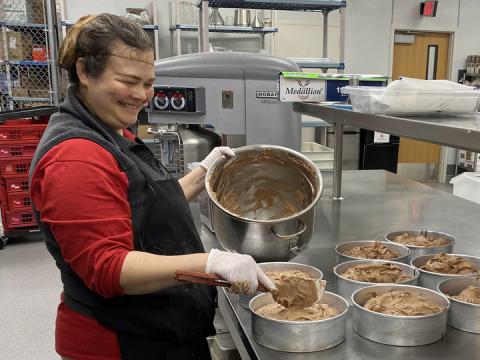 Diemhong "Hong" Tran prepares to bake eight mocha chocolate cheesecakes at Cather Dining Center on Nov. 13. Tran is the desserts team leader for University Dining Services and is instrumental in creating desserts from scratch across campus.