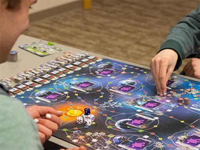 Students enjoy scheming and conversation at the Games Guild's weekly meeting in room 111 of the College of Business on Friday, Feb. 10, 2023. [photo by Jerry Saguin | Daily Nebraskan]