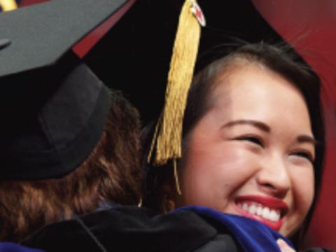 Students hugging at Nebraska commencement